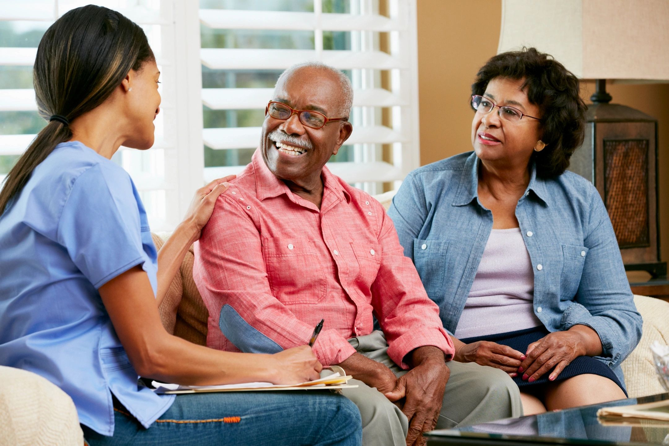 Caregiver helping elderly woman with personal care
